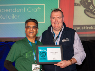 SIBA Business Awards 2024 Krishan collecting the award for "UK's Best Independent Craft Beer Retailer" from Andy Slee (Chief Executive of SIBA) at the SIBA Business Awards 2024.